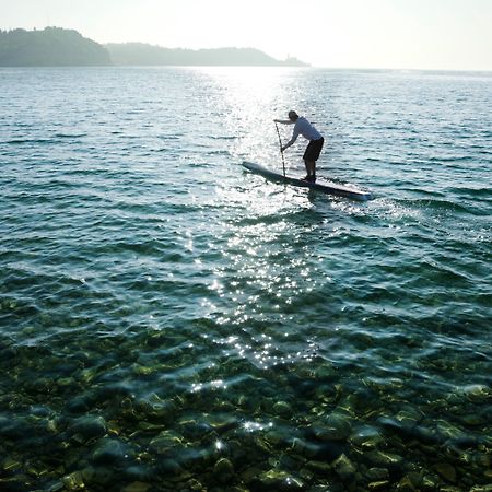 Hotel Slovenija - Terme & Wellness Lifeclass ポルトローシュ エクステリア 写真 Stand-up paddle boarder on Lake Balaton